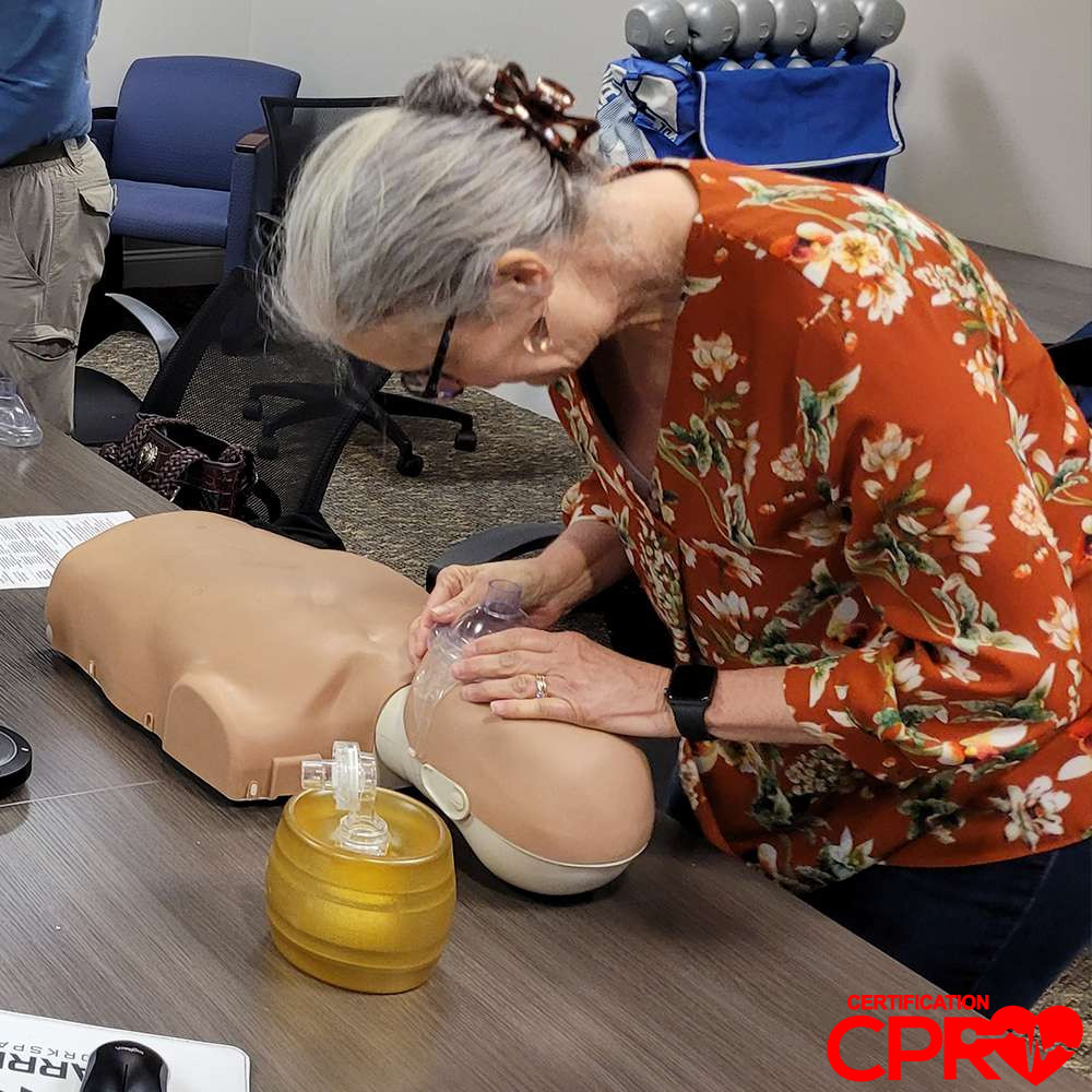 CPR training session with adult mannequin in Durham.
