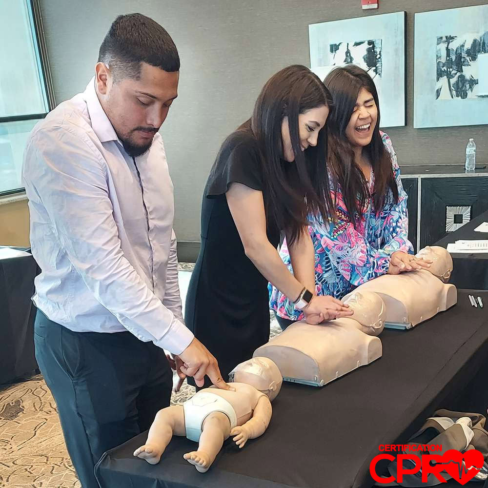 CPR training class in Durham with students practicing on mannequins.