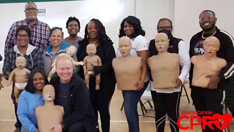 Group CPR training session in Durham with mannequins for certification.